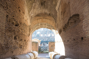 Colosseum arch and ruins of columns in Rome roman amphitheater, Italy. Main italian landmark