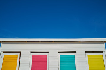 blue sky and colorful doors