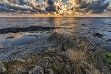 Sunrise on coast of sea