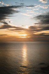 Golden light reflection on the sea during sunrise