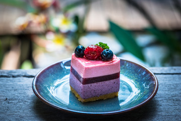 Homemade cheesecake with fresh blueberries and raspberry for dessert 