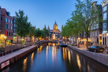 Saint Nicholas Church at night in Amsterdam city, Netherlands