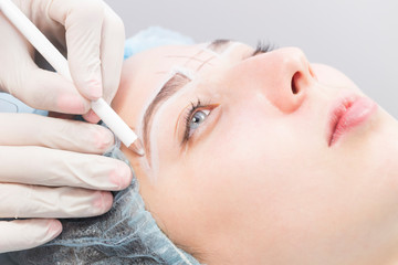 Obraz na płótnie Canvas Microblading eyebrows workflow in a beauty salon