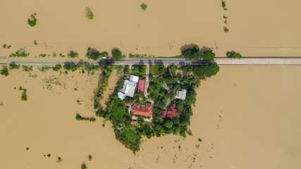 Aerial top view of Flooded rice paddies and the village, View from above shot by drone