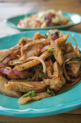 Thai northeast food, Nam-Tok Thai food made from pork and herbs in a green dish
