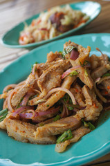Thai northeast food, Nam-Tok Thai food made from pork and herbs in a green dish