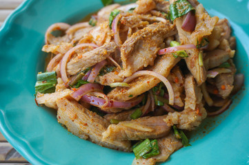 Thai northeast food, Nam-Tok Thai food made from pork and herbs in a green dish