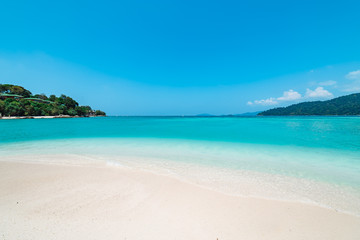 Pristine white beach with azure blue ocean