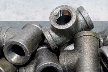 Metal sanitary tees for water supply pipes.