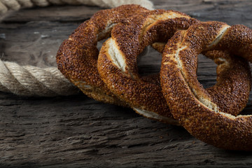 Turkish Simit bagels on the wooden background for breakfast concept.