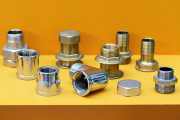 A variety of plumbing pipe connectors, adapters