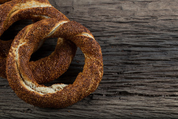 Turkish Simit bagels on the wooden background for breakfast concept.