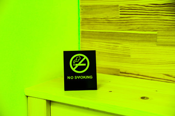 No smoking sign on the bedside table. Hotel things.