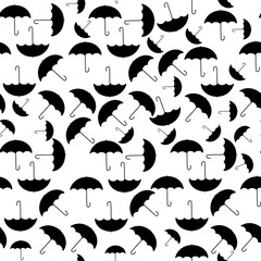 Vector seamless autumn pattern with black umbrellas on white background.