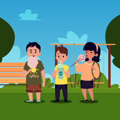 Caucasian and asian children, boys and a girl stand in the park and eat sweets.