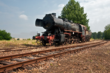 Fototapeta na wymiar steam locomotive waiting for signal to start moving