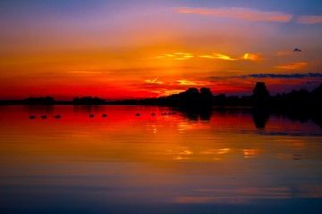 Fototapeta premium Colorful sky in sunset over the lake