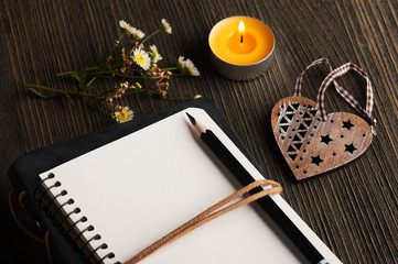 empty notebook with wild flowers, heart