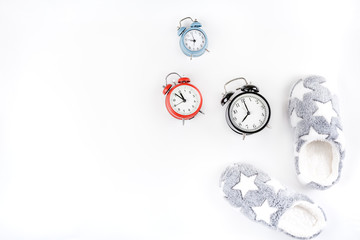 Soft fluffy slippers and alarm clocks