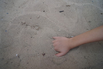 hand  in sand