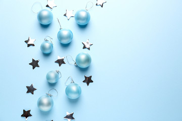 Beautiful Christmas balls and decor on color background