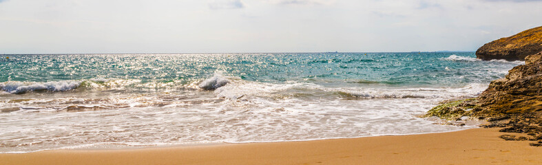 Close up of the sea water affecting the sand on the beach, sea waves calmly flowing sand, relaxing view