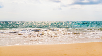 Close up of the sea water affecting the sand on the beach, sea waves calmly flowing sand, relaxing view