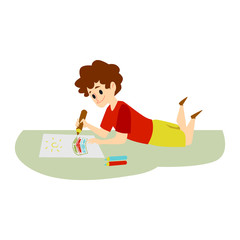 Little caucasian kid boy drawing on paper with pencils.