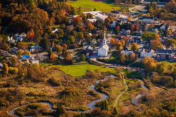 Aerial view of the town of Stowe Vermont on a colorful autumn afternoon