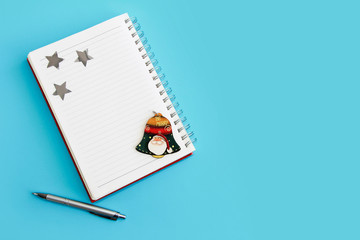 business notepad for spiral notes, stationery pen and christmas decor for new year holiday