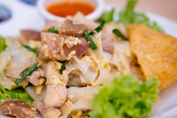 Chinese-Thai dish made with stir-fried rice noodles mixed with chicken
