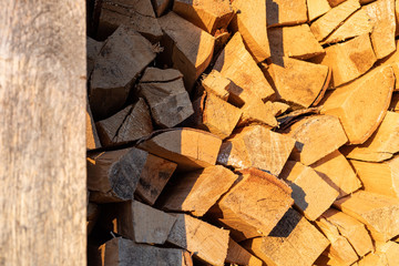 Firewood background at sunset, rural concept
