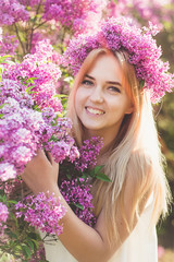 Girl blonde in lilac closeup