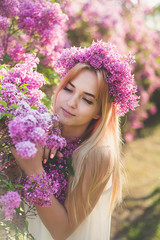 Girl blonde in lilac closeup