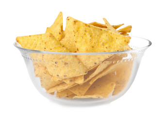 Glass bowl with tasty Mexican nachos chips on white background
