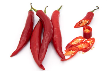 Red pepper, top view, cut into thin strips on white background 