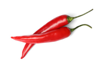 Ripe red hot chili peppers on white background, top view