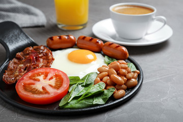 Delicious breakfast with fried egg served on table