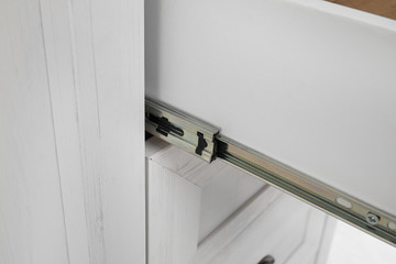 Closeup view of open drawer. Furniture for wardrobe room