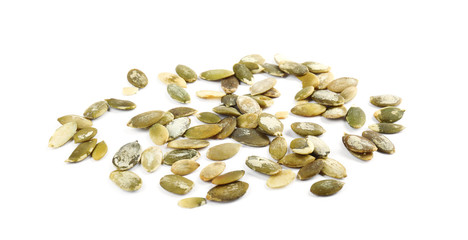 Raw peeled pumpkin seeds on white background