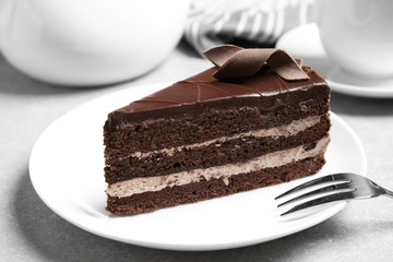 Delicious fresh chocolate cake served on table, closeup