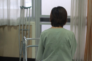 An Asian patient girl crying and anxiety in the hospital before surgery.
