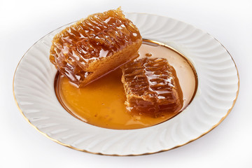 honeycomb in a plate on white background