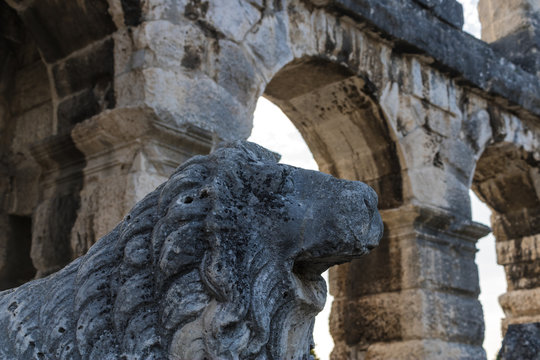 Lion statue inside the Pula Arena (Arena di Pola), famous Roman amphitheatre in Pula, Croatia - Image