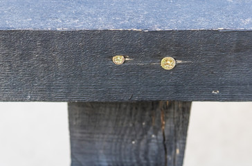 Screw in wood, two screws screwed in the black wood, wood plank with screws close-up - Image