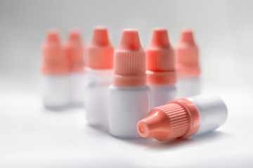 Lots of plastic bottles with a drug on white background