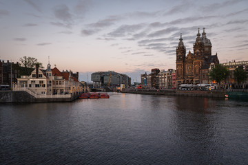 Fototapeta na wymiar Sunset in Amsterdam canal, Netherlands