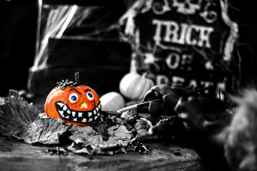 Happy Halloween. Werewolf or zombie hands painting scary pumpkin for trick or treat party.