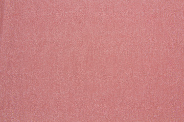 Fototapeta premium Lurex fabric is red. Shiny fabric texture