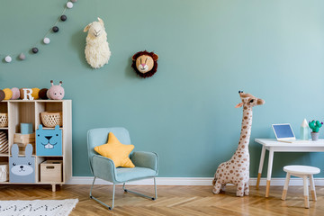 Interior design of scandinavian childroom with wooden cabinet, mint armchair, white desk, a lot of...